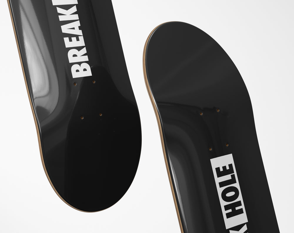 Black skateboard featuring a logo BreakHole design