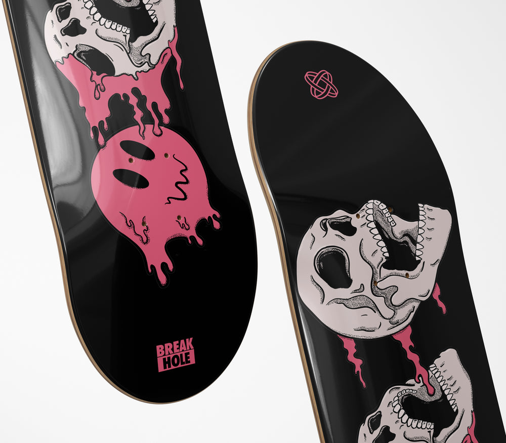 Black skateboard featuring a skull design