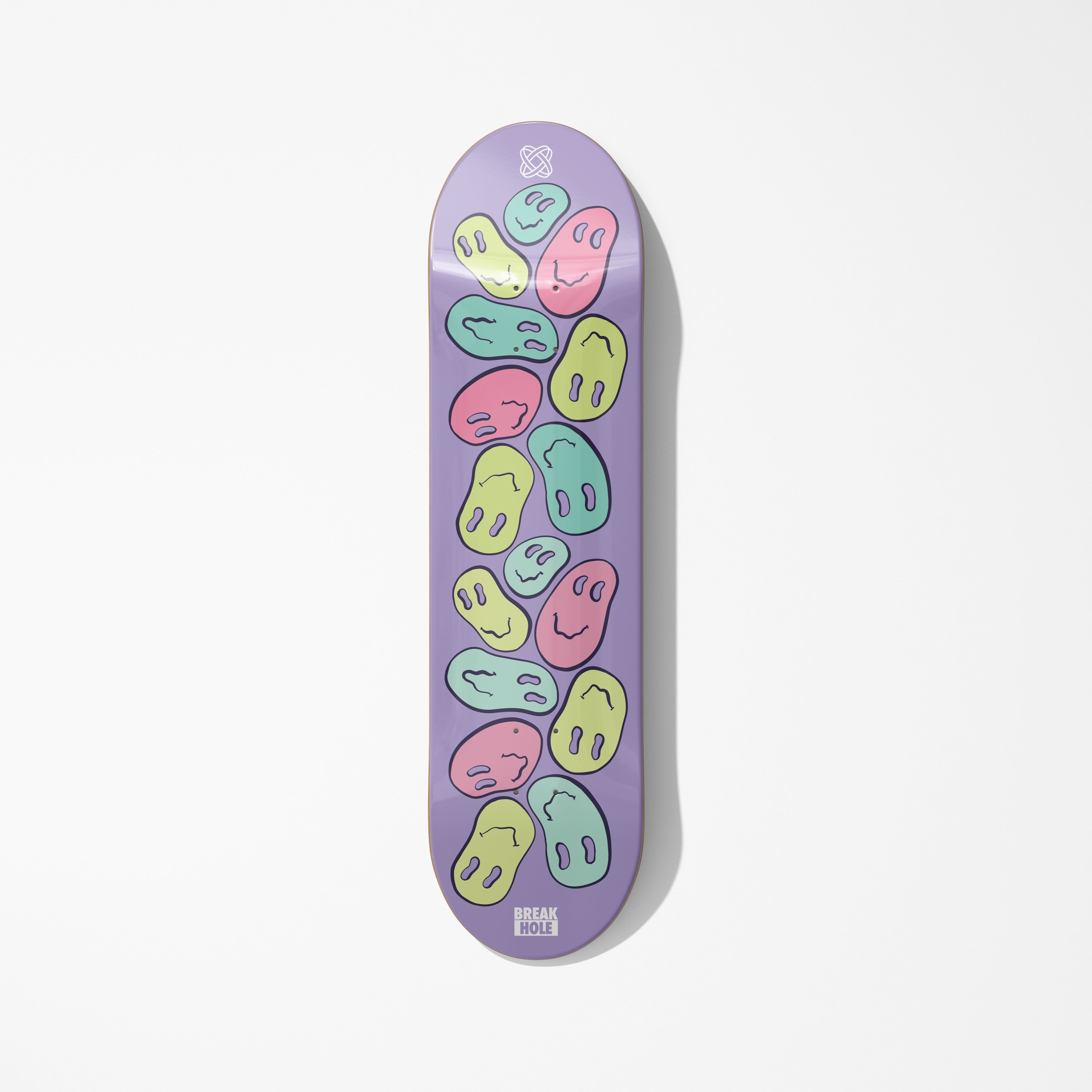 Purple skateboard deck adorned with numerous smiley faces
