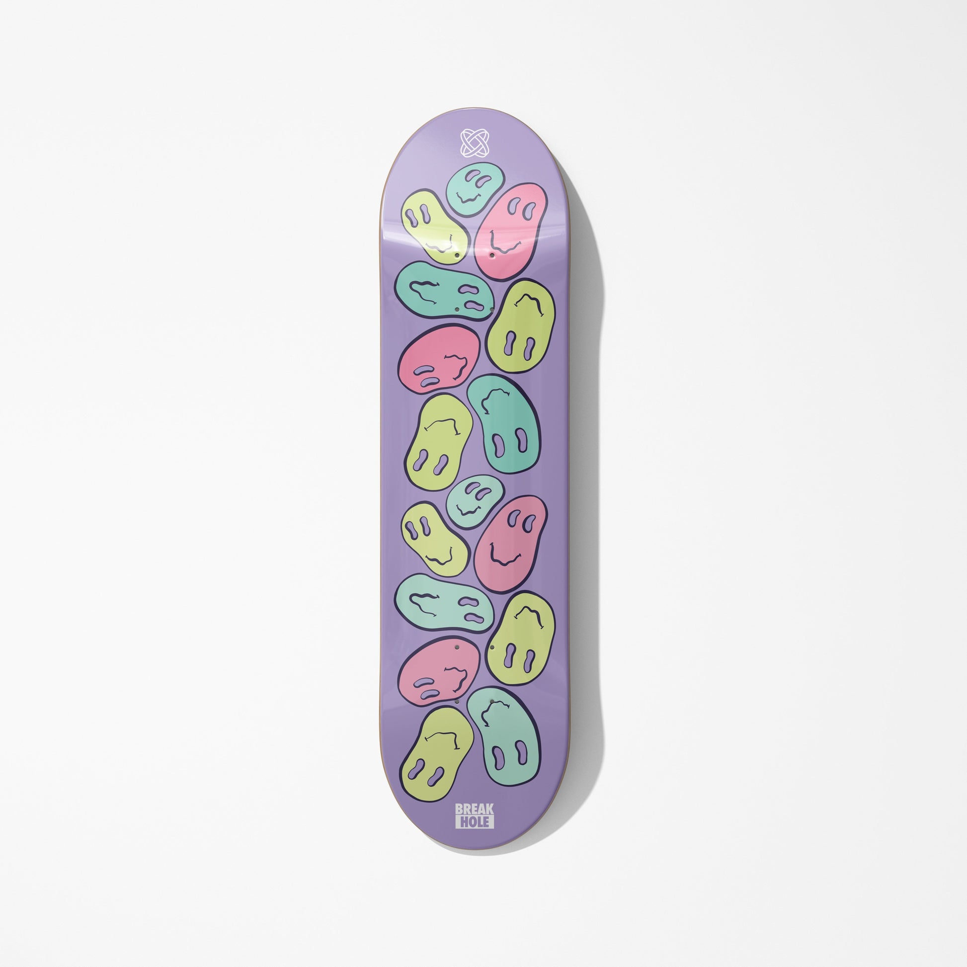 Purple skateboard deck adorned with numerous smiley faces
