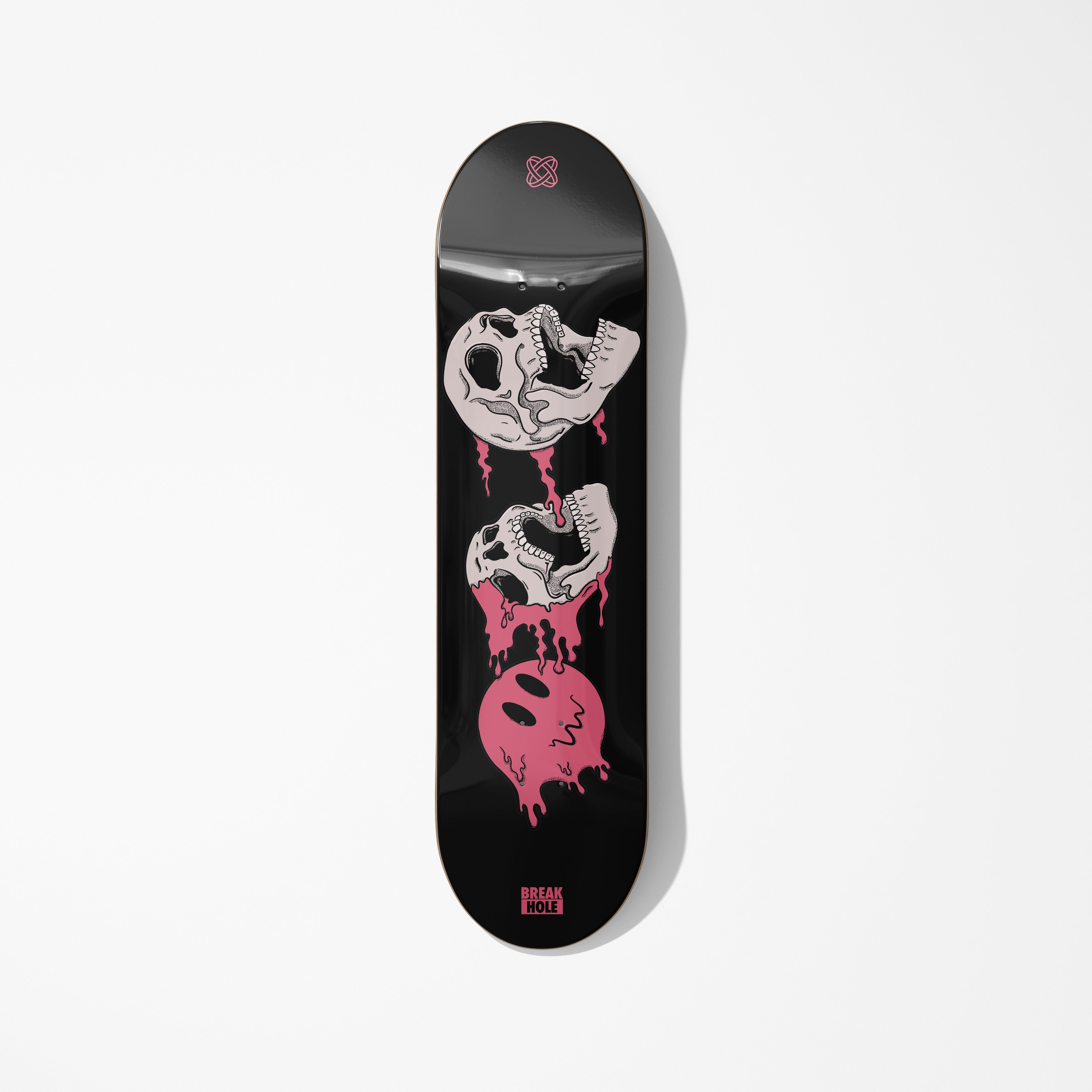 Black skateboard featuring a skull design
